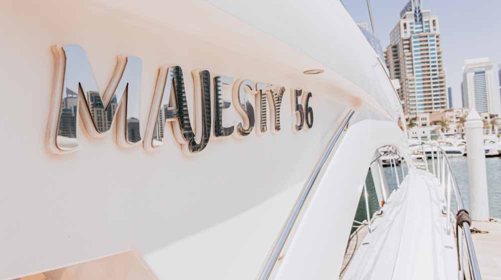 exterior sideview of yacht says ''majesty 56'' brand